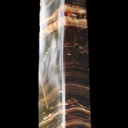 Chocolate Calcite obelisk 113*33*21mm 201g in sunlight - Rocks and Things Store