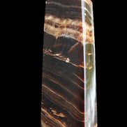 Chocolate Calcite obelisk 113*33*21mm 201g in sunlight - Rocks and Things Store