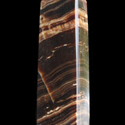 Chocolate Calcite obelisk 113*33*21mm 201g in sunlight - Rocks and Things Store