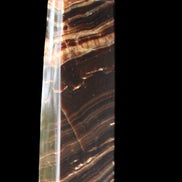 Chocolate Calcite obelisk 113*33*21mm 201g in sunlight - Rocks and Things Store