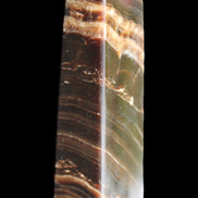 Chocolate Calcite obelisk 113*33*21mm 201g in sunlight - Rocks and Things Store