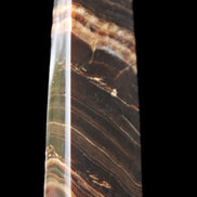 Chocolate Calcite obelisk 113*33*21mm 201g in sunlight - Rocks and Things Store