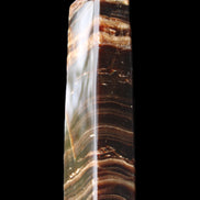 Chocolate Calcite obelisk 113*33*21mm 201g in sunlight - Rocks and Things Store
