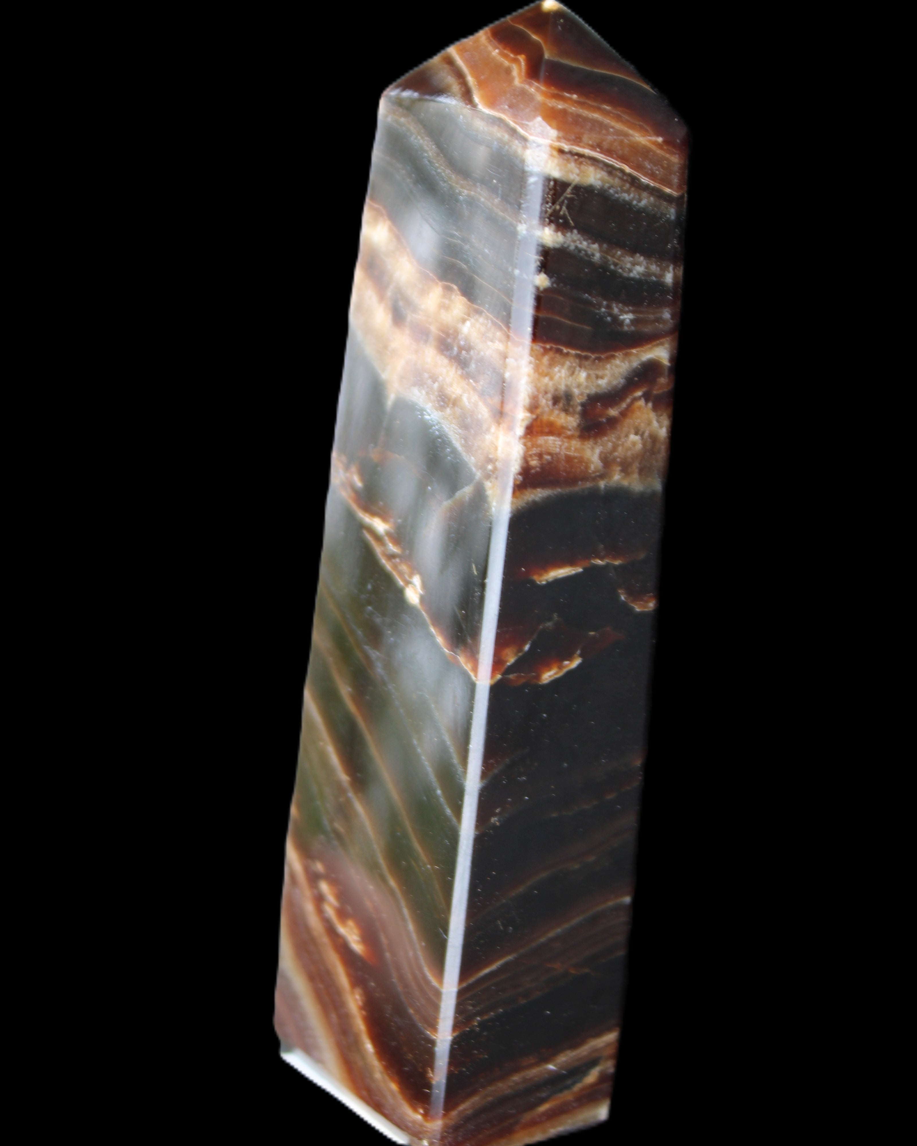 Chocolate Calcite obelisk 113*33*21mm 201g in sunlight - Rocks and Things Store