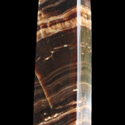 Chocolate Calcite obelisk 113*33*21mm 201g in sunlight - Rocks and Things Store