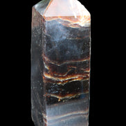 Chocolate Calcite obelisk 105*35*32mm 295g in sunlight - Rocks and Things Store