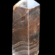 Chocolate Calcite obelisk 105*35*32mm 295g in sunlight - Rocks and Things Store