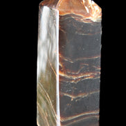 Chocolate Calcite obelisk 105*35*32mm 295g in sunlight - Rocks and Things Store