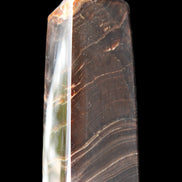 Chocolate Calcite obelisk 105*35*32mm 295g in sunlight - Rocks and Things Store