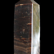 Chocolate Calcite obelisk 105*35*32mm 295g in sunlight - Rocks and Things Store