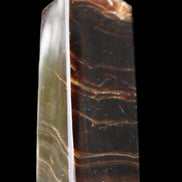 Chocolate Calcite obelisk 105*35*32mm 295g in sunlight - Rocks and Things Store