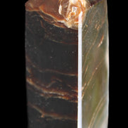 Chocolate Calcite obelisk 105*35*32mm 295g in sunlight - Rocks and Things Store