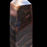 Chocolate Calcite obelisk 105*35*32mm 295g in sunlight - Rocks and Things Store