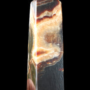 Chocolate Calcite obelisk 112*33*26mm 203g in sunlight - Rocks and Things Store