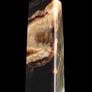 Chocolate Calcite obelisk 112*33*26mm 203g in sunlight - Rocks and Things Store