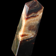 Chocolate Calcite obelisk 112*33*26mm 203g in sunlight - Rocks and Things Store
