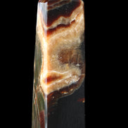 Chocolate Calcite obelisk 112*33*26mm 203g in sunlight - Rocks and Things Store