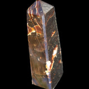Chocolate Calcite obelisk 110*32*27mm 187g in sunlight - Rocks and Things Store