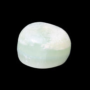 Pistachio Calcite tumbled stone 25-32mm 21-32g in sunlight - Rocks and Things Store