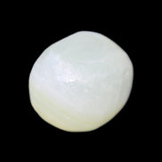 Pistachio Calcite tumbled stone 25-32mm 21-32g in sunlight - Rocks and Things Store