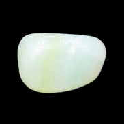 Pistachio Calcite tumbled stone 25-32mm 21-32g in sunlight - Rocks and Things Store
