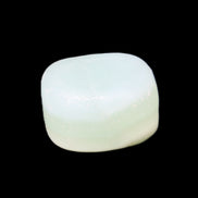 Pistachio Calcite tumbled stone 25-32mm 21-32g in sunlight - Rocks and Things Store