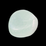 Pistachio Calcite tumbled stone 25-32mm 21-32g in sunlight - Rocks and Things Store