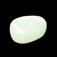 Pistachio Calcite tumbled stone 25-32mm 21-32g in sunlight - Rocks and Things Store