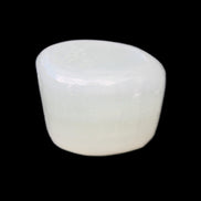 Pistachio Calcite tumbled stone 25-32mm 21-32g in sunlight - Rocks and Things Store