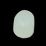 Pistachio Calcite tumbled stone 25-32mm 21-32g in sunlight - Rocks and Things Store