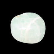 Pistachio Calcite tumbled stone 25-32mm 21-32g in sunlight - Rocks and Things Store