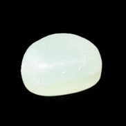 Pistachio Calcite tumbled stone 25-32mm 21-32g in sunlight - Rocks and Things Store