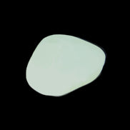 Pistachio Calcite tumbled stone 20-23mm 6-9g in sunlight - Rocks and Things Store