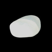 Pistachio Calcite tumbled stone 20-23mm 6-9g in sunlight - Rocks and Things Store
