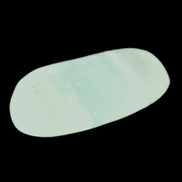 Pistachio Calcite tumbled stone 20-23mm 6-9g in sunlight - Rocks and Things Store