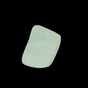 Pistachio Calcite tumbled stone 20-23mm 6-9g in sunlight - Rocks and Things Store