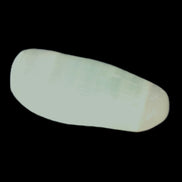 Pistachio Calcite tumbled stone 20-23mm 6-9g in sunlight - Rocks and Things Store