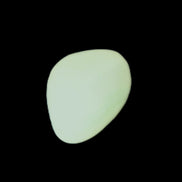 Pistachio Calcite tumbled stone 20-23mm 6-9g in sunlight - Rocks and Things Store