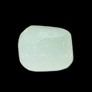 Pistachio Calcite tumbled stone 30-37mm 21-29g in sunlight - Rocks and Things Store