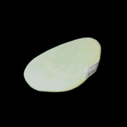 Pistachio Calcite tumbled stone 30-37mm 21-29g in sunlight - Rocks and Things Store