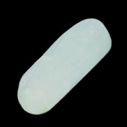 Pistachio Calcite tumbled stone 30-37mm 21-29g in sunlight - Rocks and Things Store