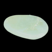 Pistachio Calcite tumbled stone 30-37mm 21-29g in sunlight - Rocks and Things Store
