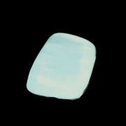 Pistachio Calcite tumbled stone 30-37mm 21-29g in sunlight - Rocks and Things Store