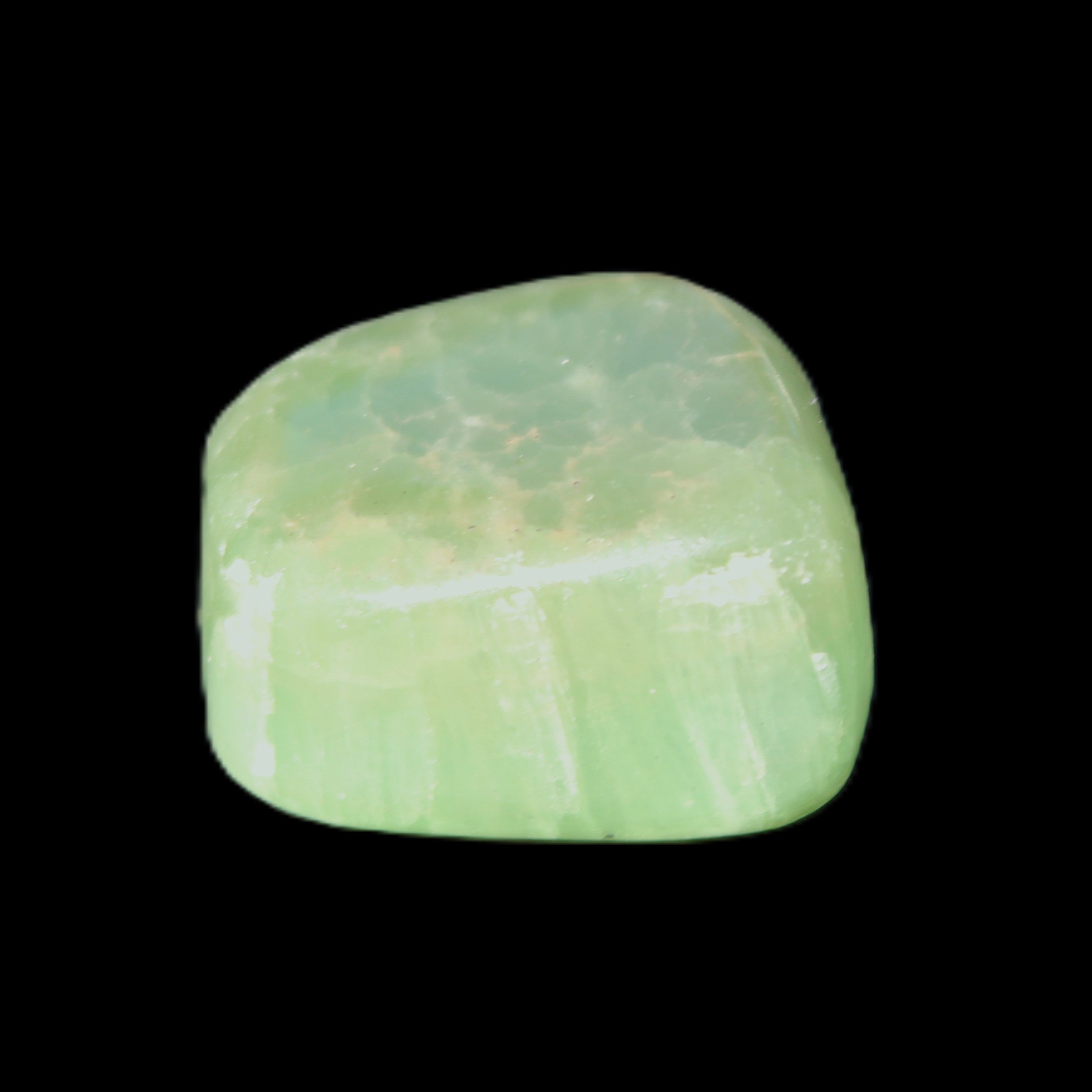 Green Aragonite tumbled stone 23*21*15mm 18g in sunlight - Rocks and Things Store