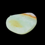 Pistachio Calcite tumbled stone 20-31mm 12-18g in sunlight - Rocks and Things Store
