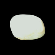 Pistachio Calcite tumbled stone 20-31mm 12-18g in sunlight - Rocks and Things Store