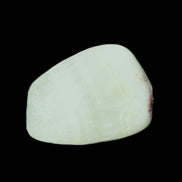 Pistachio Calcite tumbled stone 20-31mm 12-18g in sunlight - Rocks and Things Store
