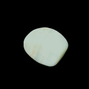 Pistachio Calcite tumbled stone 20-31mm 12-18g in sunlight - Rocks and Things Store
