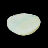 Pistachio Calcite tumbled stone 20-31mm 12-18g in sunlight - Rocks and Things Store
