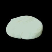 Pistachio Calcite tumbled stone 20-31mm 12-18g in sunlight - Rocks and Things Store